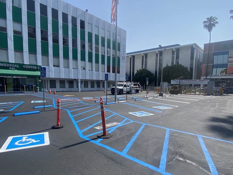 Accessible parking stalls and hatched access aisle at an office campus
