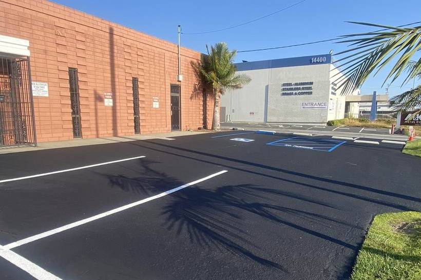 Industrial park parking lot with new stalls and concrete wheel stops